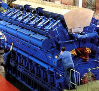 Alstom workers make final preparation at the factory on this medium speed four stroke marine engine. 